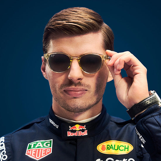 Man wearing sunglasses with a blue background